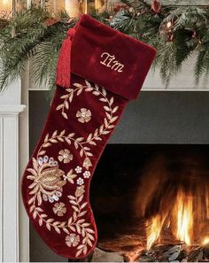 a christmas stocking hanging from a fireplace