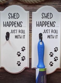 there are two signs that say shed happens, just roll with it and they have paw prints on them