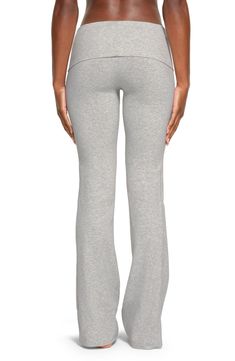 These go-to lounge pants from Kim Kardashian's SKIMS line are cut from soft cotton jersey with a deep fold-over waist. 32" inseam; 19" leg opening; 10" front rise; 13 1/2" back rise (size Medium) 90% cotton, 10% elastane Machine wash, tumble dry Imported Casual Yoga Pants, Grey Sweats Outfit, Yoga Sets Outfit, Fold Over Leggings, Fold Over Yoga Pants, Yoga Outfits, Outfit Yoga, Pilates Studio, Yoga Pants Outfit