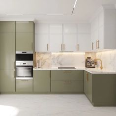 an empty kitchen with marble counter tops and green cupboards on the wall, along with white cabinets