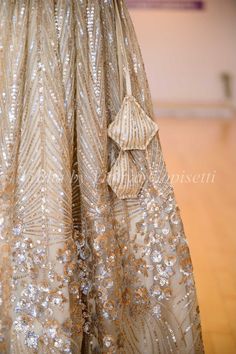 Get ready to make a statement with our Champagne Gold Sequins And Cut Dana Embroidered Lehenga Set. Made from premium fabric, it boasts stunning sequin and cutdana embroidery for a luxurious touch. Complete with a stylish ruffled dupatta and frilled hem sleeves, this ensemble is perfect for any special occasion.. Anita Dongre Bridal, Sequin Lehenga, Net Sleeves, Gold Lehenga, Embroidered Lehenga, Lehenga Blouse, Hand Embroidery Art, Gold Sequins, Kids Pants