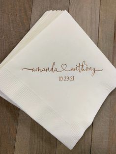 two personalized napkins on top of each other