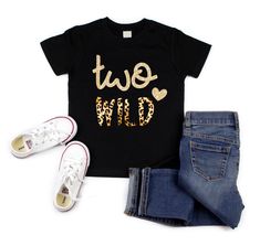 a t - shirt that says, two wild on it next to jeans and sneakers