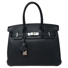 Hermes Black Birkin 30 Bag. Palladium silver hardware. Togo leather. Interior clean. Exterior looks like new. Plastic is still on the hardware. Classic black Birkin with modern silver. Great investment bag. Most wanted size 30. Includes clochette, lock ,keys, and dust bag. Guaranteed authentic. Classic Evening Bag With Lock, High-end Office Satchel With Silver-tone Hardware, Everyday Luxury Black Bag With Lock, Luxury Black Bag With Lock For Everyday, Classic Business Shoulder Bag With Lock, Modern Formal Shoulder Bag With Lock, Classic Office Bag With Lock, High-end Business Bags With Lock, Luxury Office Satchel With Silver-tone Hardware