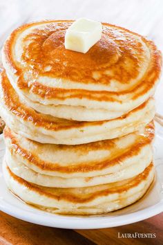 a stack of pancakes with butter on top