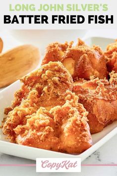 fried fish on a white plate with text that reads long john silver's batter fried fish