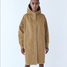 Zara Hooded Parka With A High Neck And Long Cuffed Sleeves. Front Pockets. Contrasting Piping. Front Zip And Hidden Snap Buttons. Size L. Armpit To Armpit 26, Length 38” Fall Jacket Trends, Zara Trench Coat, Long Parka, Suede Coat, Basic Jackets, Hooded Parka, Knitted Coat, Contrast Piping, Quilted Coat