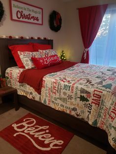 a bedroom decorated for christmas with red and white decor on the walls, bedding and rugs