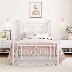 a white bed sitting in a bedroom on top of a rug