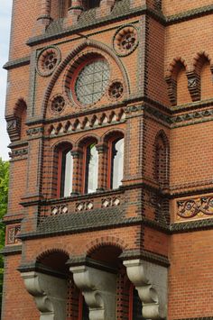 an old brick building with arched windows and arches