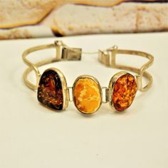 MULTI AMBER BRACELET, Sterling Silver Hinged Bracelet, Gift for Her by ANTIQUE4YOU Three amber bracelet, Multi color amber, Amber silver jewelry, Estate amber jewelry, Butterscotch amber, Cognac amber, Honey amber, Gift for Mother, Gift for wife. STAMPED 925 STERLING SILVER. 3 DIFFERENT COLOR AMBER STONES. ESTATE AMBER JEWELRY. 7.5"  GREAT GIFT FOR HER. *BEFORE PLACING ORDER, PLEASE, MAKE SURE YOUR ADDRESS IS CORRECT IF YOU PLACED ORDER WITH UNVERIFIED ADDRESS OR HAD MISTAKE IN IT AND IF PACKAGE Amber Bracelet, Amber Stone, Hinged Bracelet, Gift For Mother, Amber Jewelry, Gift For Wife, Cute Earrings, Bracelet Gift, Gifts For Wife