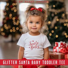 Glitter Toddler Santa Baby Jersey Tee. Firstly, this design features Santa Baby. Secondly, it is in Red Glitter. Definitely, this Holiday or Christmas Party Tee is a must have. In addition, they are CPSIA COMPLIANT.   --Solid - 100% cotton, 32 singles --Pre-Shrunk --Side seam --Tear away label --Eco-Friendly {SIZE AND COLOR}: See size chart  above. Please keep in mind that the shirt colors may slightly vary from what you are seeing on your screen. {CARE INSTRUCTIONS} Machine wash cold, inside out, with like colors. Only non-chlorine bleach. Tumble dry low. Do not iron if decorated. In addition, be sure to check out our Santa Baby Soft Baby One-Piece at: https://www.etsy.com/listing/1789553297 Also, be sure to check out our other Bella Canvas Blanks at: https://www.etsy.com/listing/10949029 Holiday Party Tops, Baby Glitter, Glitter Tee, Santa's Sleigh, Holiday Tops, Toddler Christmas, Santa Sleigh, I Trust, Santa Baby