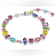 This Joyful, Prismatic Bracelet From The Gema Family Features A Shimmering Mix Of Crystals In The Prettiest Pastel Shades On A Refined Rhodium Plated Setting. The Dazzling Array Of Cuts And Colors Is Arranged In An Organic, Yet Precise, Way Resulting In A Piece Of Unexpected Beauty. Wear This Bracelet Alone Or With Matching Gema Jewelry To Inject Vibrancy Into Your Everyday. Collection: Gema Length (Minimum - Maximum): 6 1/2 - 8 1/8 Inch Width: 3/8 Inch Material: Crystals, Rhodium Plated Color: Unexpected Beauty, Slide Bracelet, Jewelry Swarovski, Swarovski Crystal Bracelet, Swarovski Bracelet, Crystal Bangle, White Bracelets, Pretty Jewelry, Pastel Shades