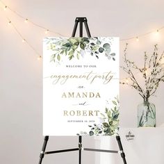 an easel with a sign that says, welcome to our engagement party or amanda roberts