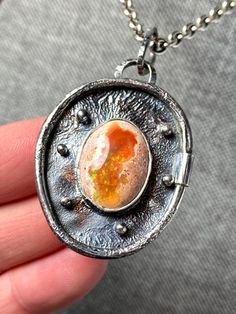 Amazing Rare Mexican Fire Opal Pendant in sterling silver  Materials:  Silver 925, Mexican Fire opal Height - 2 1/8" (full size with bail), Width - 1 1/4" Unique Handcrafted One-of a-kind Design Pendant Each Piece of Jewelry in my Collection is Absolutely One of a Kind! When you start wearing a piece of my jewelry you will fall in love with it more and more each day and feel that good Energy and Love that I pass into it while creating this piece of Art. A piece of Art created for you to be inspi Fusion Style Opal Jewelry For Gifts, Fusion Style Opal Jewelry Gift, Unique Round Ethiopian Opal Jewelry, Unique Ethiopian Opal Round Jewelry, Unique Oval Opal Necklaces, Handmade Oval Ethiopian Opal Necklaces, Handmade Oval Ethiopian Opal Necklace, Unique Ethiopian Opal Gemstone Jewelry, Handmade Silver Necklace With Ethiopian Opal