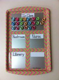 a bulletin board with buttons and magnets on it