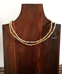 "Tulsi beads mala necklace. It can be rounded twice around neck. This beaded necklace can be worn by men as well as women. Tulsi beads are made from Tulsi (Holy Basil) plant wood, considered as most sacred in India. Tulsi plant is worshipped in India and the food offered to Indian Gods is incomplete without the offereing of Tulsi leaves along with it. Tulsi Mala provides protection to the wearer and is said to maintain Health, provide Peace of Mind and reduce Stress. They are used to worship Lor Traditional Adjustable Heishi Beads Necklace, Gold Heishi Beads Necklace Hand-strung, Gold Hand-strung Heishi Beads Necklace, Traditional Double Strand Beads For Gift, Traditional Heishi Beaded Necklaces, Traditional Gold Beaded Necklace With Wooden Beads, Heishi Beads Wooden Necklaces, Traditional Double Strand Beaded Necklaces For Gifts, Gold Double Strand Hand-strung Beaded Necklaces