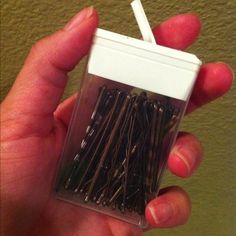 a person holding up a small package of tweezers in their left hand with the caption, use your tic container to hold all your bobby pins