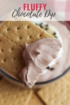 a close up of a cracker and ice cream on a plate with the words fluffy chocolate dip