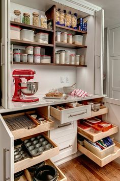 an organized kitchen with lots of drawers