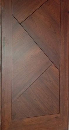 a close up of a wooden door with diamond design