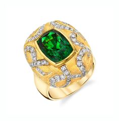 This bold ring makes a statement! The stunning 7.26 carat tsavorite garnet featured in this ring possesses a vivid, rich green color and unusually high level of clarity. Round brilliant cut diamonds set in dramatic swirls around the center bezel create a striking contrast of texture and color against the elegant matte finish. Handmade by our Master Jewelers, this one-of-a-kind ring will attract attention wherever you go!Tsavorite garnet measures 12.1 x 8.4mm, 7.26 caratsRound brilliant cut diamo Luxury Formal Tsavorite Ring, Luxury Tsavorite Round Cut Emerald Ring, Luxury Classic Tsavorite Diamond Ring, Luxury Green Tsavorite Diamond Ring, Luxury Tsavorite Round Ring, Luxury Tsavorite Rings, Luxury Tsavorite Diamond Ring, Luxury Tsavorite Rings With Round Cut, Luxury Tsavorite Round Cut Rings