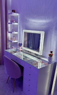 a desk with a mirror, chair and shelf in a room that has purple walls