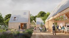 an artist's rendering of people sitting at outdoor tables in front of wooden buildings