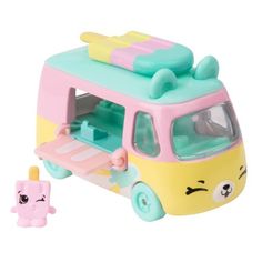 a small toy bus with an ice cream cone on the top and a smaller one behind it