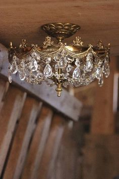 a gold chandelier hanging from the ceiling