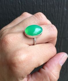 Lovely Elegant Oval Bright Green Chrysoprase Sterling Silver Ring by GildedBug on Etsy Green Oval Chalcedony Rings, Oval Green Chalcedony Rings, Handmade Green Oval Cabochon Ring, Handmade Green Rings For Everyday, Handmade Green Rings For Everyday Wear, Handmade Green Chalcedony Rings, Green Chrysoprase Cabochon Rings, Green Chalcedony Gemstone Rings, Chrysoprase Emerald Ring With Oval Cabochon For Gift