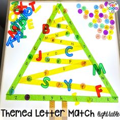 the letter match is made from construction paper and colored crayons to make a christmas tree