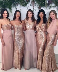 the bridesmaids are posing for a photo in their pink dresses and gold sequins