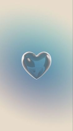 a heart shaped object floating in the air with blue and white colors on it's surface