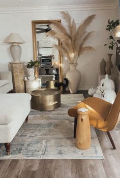 a living room filled with lots of furniture and decor