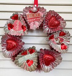 valentine's day wreath made out of wine bottle caps with saying be my valentine