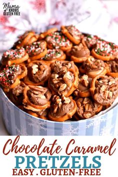 a tin filled with lots of pretzels on top of a white and blue table