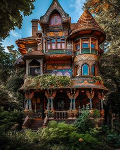 an elaborately designed house in the woods