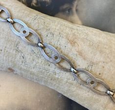 This listing is for a sterling bracelet with a double link motif style. There is a functioning, secure fold over clasp on the end. The entire bracelet measures 6 3/4". This would be a smaller size bracelet. Marked "sterling" on the back of the clasp. In nice vintage condition. Tarnished. Thanks. Vintage Silver Chain Link Bracelets, Silver Vintage Chain Link Bracelets, Vintage Adjustable Bracelet With Oval Links, Vintage Oval Link Chain Bracelet, Vintage Sterling Silver Bracelet With Lobster Clasp, Vintage Adjustable Oval Link Bracelets, Vintage Nickel-free Formal Chain Bracelet, Vintage Metal Link Bracelet, Vintage Link Bracelets With Lobster Clasp