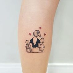 a woman's leg with a tattoo on it that has an image of two people sitting