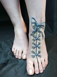 a woman's foot with a tattoo on it