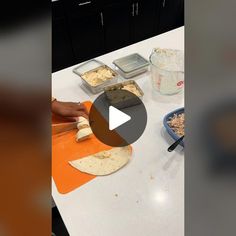 a video demonstrating how to make tortillas with cheese and other ingredients on a counter top