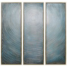 three abstract paintings in blue and silver with circles on the bottom, one is circular