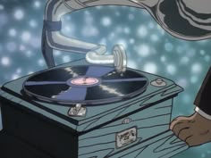 a person holding a record player in their right hand and touching it with the other hand