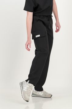 Bringing comfort and elegance to your workspace with our Jogger or Straight Fit scrub pants for Women. How does it fit High waisted for the feminine figure. Scrubbies signature waistband, adjustable and elasticated. Cargo pocket Flexi fabric that is soft, with a mild stretch, for ease of movement. Tapered cut with slits on the ankles. Model is wearing size XS: height 5’4 (164cm), waist 25, weight 110lbs (50kg) Joggers Outfit Casual, Jogger Outfit Casual, Scrub Shoes, Scrubs Uniform, Black Scrubs, Scrub Life, Joggers Outfit, Medical Art