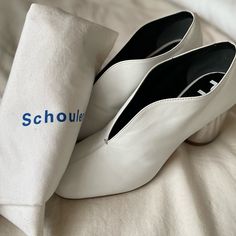 Modern And Elegant, These White Leather Heels From Proenza Schouler Are A Stylish Choice For Any Occasion. Made In Italy, These Shoes Feature A Distinct Design With A Metallic Heel Measuring 2.5 Inches. Perfectly Pairing Innovation With Timeless Craftsmanship, These Heels Come With A Schouler-Branded Dust Bag White Leather Block Heel Court Shoes, White Closed Toe Court Shoes With Stacked Heel, White Square Toe Court Shoes For Office, Chic White Square Toe Court Shoes, White Court Shoes With Stacked Low Heel, Chic White Court Shoes With Square Toe, White Almond Toe Court Shoes For Workwear, White Almond Toe Court Shoes For Work, White Court Shoes With Stacked Heel And Round Toe