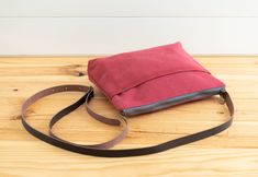 "The Marabara Day bag has been designed to accompany you every day. It is made of cotton canvas in a nice burgundy colour. Don't be tricked by its small size, this bag is roomy enough to carry all your daily essentials (wallet, phone, notebook, sunglasses...) and it's light as a feather. You won't even notice you are carrying it, so comfortable that you will want to take it with you all the time. It closes with a metal zipper and comes with an adjustable leather strap, in chocolate colour. It is Red Canvas Shoulder Bag For Gifts, Red Canvas Crossbody Shoulder Bag, Red Crossbody Canvas Shoulder Bag, Everyday Red Canvas Satchel, Red Canvas Satchel Shoulder Bag, Red Canvas Shoulder Bag With Zipper, Red Canvas Shoulder Bag With Zipper Closure, Red Canvas Shoulder Satchel, Red Crossbody Canvas Bag For Daily Use