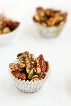 small cups filled with nuts on top of a table