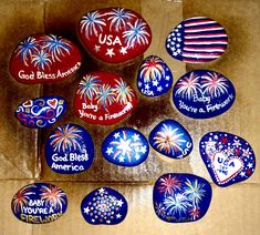 painted rocks with the words usa and fireworks on them