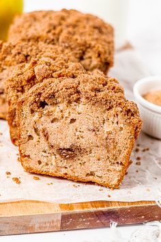 some type of bread sitting on top of a cutting board